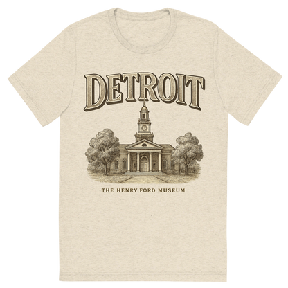 Front view of a Premium Tri-Blend Crew Neck T-Shirt in Oatmeal showing 'A typographic, nostalgic graphic of a typographic illustration of the words 'detroit' with a vintage line art drawing of the the henry ford museum'