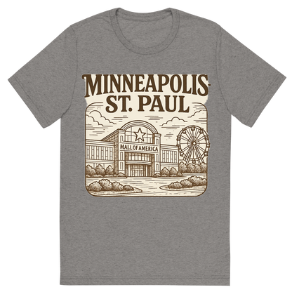 Front view of a Premium Tri-Blend Crew Neck T-Shirt in Grey showing 'A typographic, nostalgic graphic of a typographic illustration of the words 'minneapolis-st. paul' with a vintage line art drawing of the mall of america'