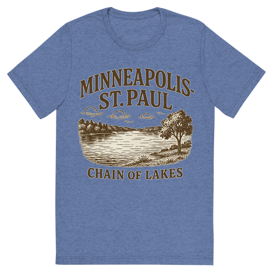 Front view of a Premium Tri-Blend Crew Neck T-Shirt in Blue showing 'A typographic, nostalgic graphic of a typographic illustration of the words 'minneapolis-st. paul' with a vintage line art drawing of the chain of lakes'