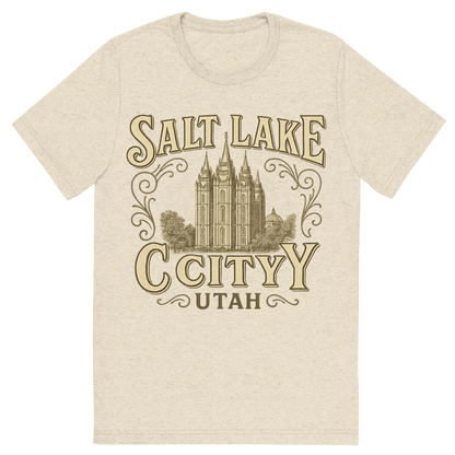 Front view of a Premium Tri-Blend Crew Neck T-Shirt in Oatmeal showing 'A typographic, nostalgic graphic of a typographic illustration of the words 'salt lake city, utah' with a vintage line art drawing of the temple square'