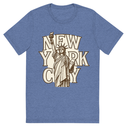 Front view of a Premium Tri-Blend Crew Neck T-Shirt in Blue showing 'A typographic, nostalgic graphic of a typographic illustration of the words 'new york city' with a vintage line art drawing of the statue of liberty'