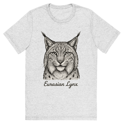 Front view of a Premium Tri-Blend Crew Neck T-Shirt in White Fleck showing 'A flat, neutral graphic of a detailed sketch of a eurasian lynx with bushy cheeks and tufted ears. “eurasian lynx” is inscribed below in elegant handwriting. detailed ink illustration on a white background.'