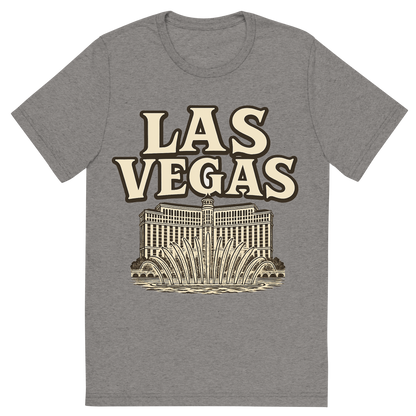 Front view of a Premium Tri-Blend Crew Neck T-Shirt in Grey showing 'A typographic, nostalgic graphic of a typographic illustration of the words 'las vegas' with a vintage line art drawing of the bellagio fountains'
