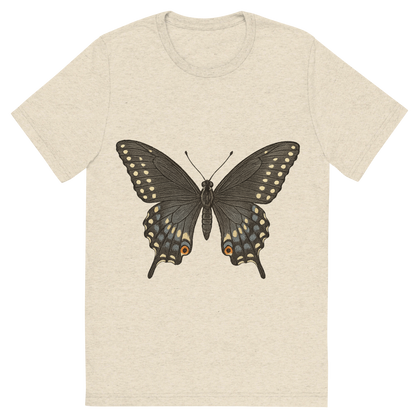 Front view of a Premium Tri-Blend Crew Neck T-Shirt in Oatmeal showing 'A hand-drawn, tranquil graphic of black swallowtail butterfly'