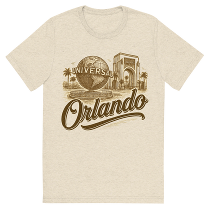 Front view of a Premium Tri-Blend Crew Neck T-Shirt in Oatmeal showing 'A typographic, nostalgic graphic of a typographic illustration of the words 'orlando' with a vintage line art drawing of the universal studios'