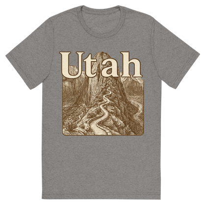 Front view of a Premium Tri-Blend Crew Neck T-Shirt in Grey showing 'A typographic, nostalgic graphic of a typographic illustration of the words 'utah' with a vintage line art drawing of the angels landing trail'