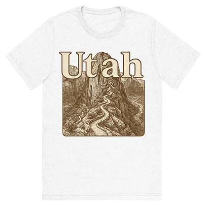 Front view of a Premium Tri-Blend Crew Neck T-Shirt in Solid White showing 'A typographic, nostalgic graphic of a typographic illustration of the words 'utah' with a vintage line art drawing of the angels landing trail'
