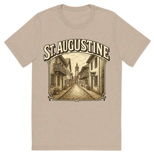 Front view of a Premium Tri-Blend Crew Neck T-Shirt in Tan showing 'A typographic, nostalgic graphic of a typographic illustration of the words 'st. augustine' with a vintage line art drawing of st. george street'
