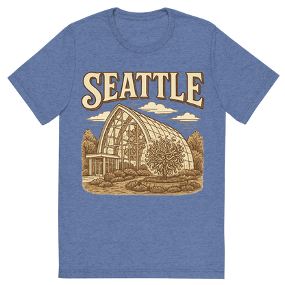 Front view of a Premium Tri-Blend Crew Neck T-Shirt in Blue showing 'A typographic, nostalgic graphic of a typographic illustration of the words 'seattle' with a vintage line art drawing of the chihuly garden and glass'