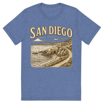 Front view of a Premium Tri-Blend Crew Neck T-Shirt in Blue showing 'A typographic, nostalgic graphic of a typographic illustration of the words 'san diego' with a vintage line art drawing of the la jolla cove'