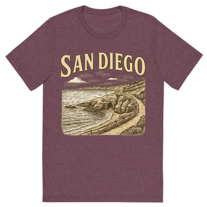 Front view of a Premium Tri-Blend Crew Neck T-Shirt in Maroon showing 'A typographic, nostalgic graphic of a typographic illustration of the words 'san diego' with a vintage line art drawing of the la jolla cove'