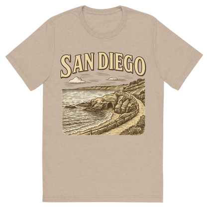 Front view of a Premium Tri-Blend Crew Neck T-Shirt in Tan showing 'A typographic, nostalgic graphic of a typographic illustration of the words 'san diego' with a vintage line art drawing of the la jolla cove'