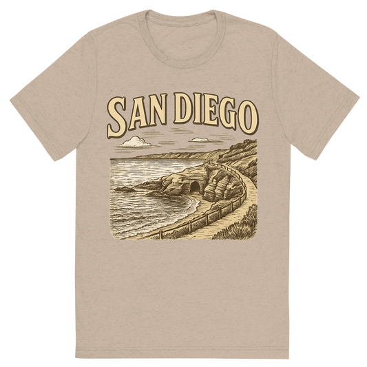 Front view of a Premium Tri-Blend Crew Neck T-Shirt in Tan showing 'A typographic, nostalgic graphic of a typographic illustration of the words 'san diego' with a vintage line art drawing of the la jolla cove'