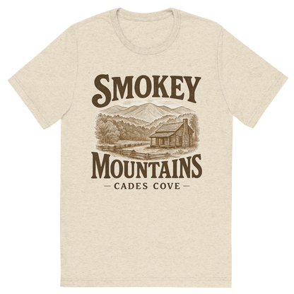 Front view of a Premium Tri-Blend Crew Neck T-Shirt in Oatmeal showing 'A typographic, nostalgic graphic of a typographic illustration of words 'smokey mountains' with a vintage line art drawing of the cades cove'