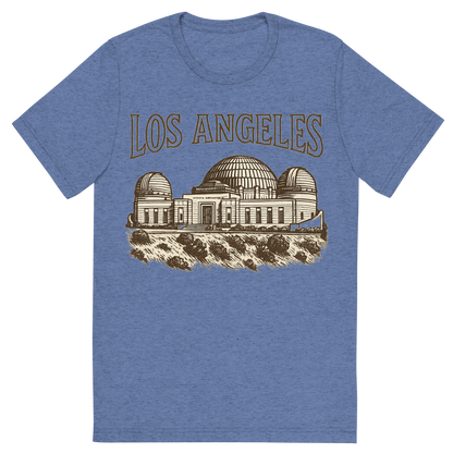 Front view of a Premium Tri-Blend Crew Neck T-Shirt in Blue showing 'A typographic, nostalgic graphic of a typographic illustration of the words 'los angeles' with a vintage line art drawing of the griffith observatory'