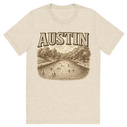 Front view of a Premium Tri-Blend Crew Neck T-Shirt in Oatmeal showing 'A typographic, nostalgic graphic of a typographic illustration of the words 'austin' with a vintage line art drawing of the barton springs pool'