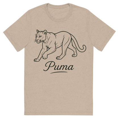 Front view of a Premium Tri-Blend Crew Neck T-Shirt in Tan showing 'A flat, neutral graphic of a clean drawing of a puma in motion with smooth lines and strong build. “puma” appears in graceful script beneath. detailed ink illustration on a white background.'