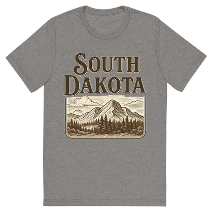 Front view of a Premium Tri-Blend Crew Neck T-Shirt in Grey showing 'A typographic, nostalgic graphic of a typographic illustration of the words 'south dakota' with a vintage line art drawing of the black hills'