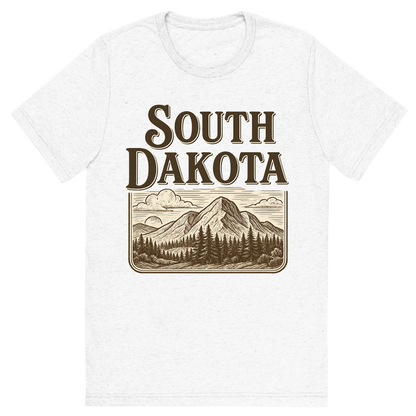 Front view of a Premium Tri-Blend Crew Neck T-Shirt in Solid White showing 'A typographic, nostalgic graphic of a typographic illustration of the words 'south dakota' with a vintage line art drawing of the black hills'