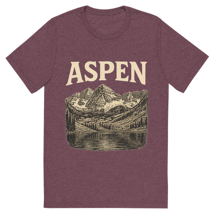 Front view of a Premium Tri-Blend Crew Neck T-Shirt in Maroon showing 'A typographic, nostalgic graphic of a typographic illustration of the words 'aspen' with a vintage line art drawing of the maroon bells'