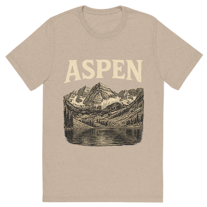 Front view of a Premium Tri-Blend Crew Neck T-Shirt in Tan showing 'A typographic, nostalgic graphic of a typographic illustration of the words 'aspen' with a vintage line art drawing of the maroon bells'