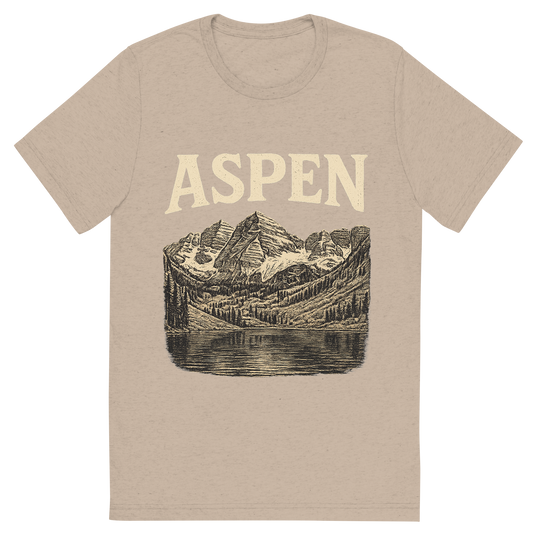 Front view of a Premium Tri-Blend Crew Neck T-Shirt in Tan showing 'A typographic, nostalgic graphic of a typographic illustration of the words 'aspen' with a vintage line art drawing of the maroon bells'