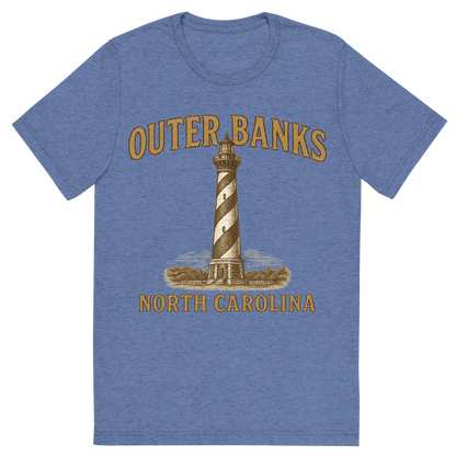 Front view of a Premium Tri-Blend Crew Neck T-Shirt in Blue showing 'A typographic, nostalgic graphic of a typographic illustration of the words 'outer banks, north carolina' with a vintage line art drawing of the cape hatteras lighthouse'