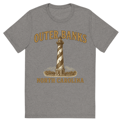 Front view of a Premium Tri-Blend Crew Neck T-Shirt in Grey showing 'A typographic, nostalgic graphic of a typographic illustration of the words 'outer banks, north carolina' with a vintage line art drawing of the cape hatteras lighthouse'