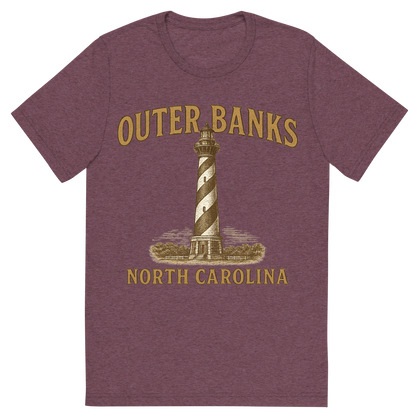 Front view of a Premium Tri-Blend Crew Neck T-Shirt in Maroon showing 'A typographic, nostalgic graphic of a typographic illustration of the words 'outer banks, north carolina' with a vintage line art drawing of the cape hatteras lighthouse'