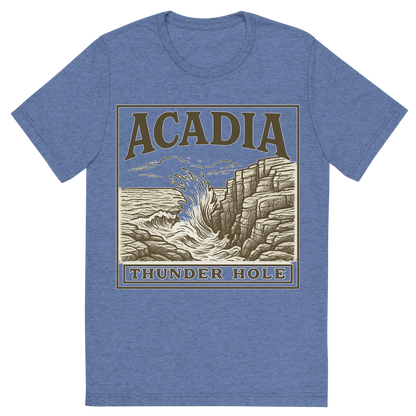 Front view of a Premium Tri-Blend Crew Neck T-Shirt in Blue showing 'A typographic, nostalgic graphic of a typographic illustration of the words 'acadia' with a vintage line art drawing of thunder hole'