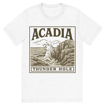Front view of a Premium Tri-Blend Crew Neck T-Shirt in Solid White showing 'A typographic, nostalgic graphic of a typographic illustration of the words 'acadia' with a vintage line art drawing of thunder hole'