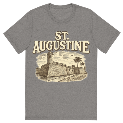 Front view of a Premium Tri-Blend Crew Neck T-Shirt in Grey showing 'A typographic, nostalgic graphic of a typographic illustration of the words 'st. augustine' with a vintage line art drawing of the castillo de san marcos'