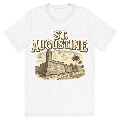 Front view of a Premium Tri-Blend Crew Neck T-Shirt in Solid White showing 'A typographic, nostalgic graphic of a typographic illustration of the words 'st. augustine' with a vintage line art drawing of the castillo de san marcos'