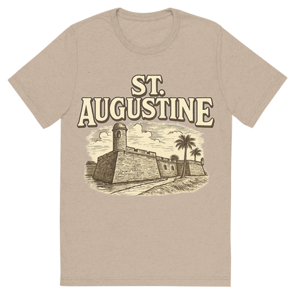 Front view of a Premium Tri-Blend Crew Neck T-Shirt in Tan showing 'A typographic, nostalgic graphic of a typographic illustration of the words 'st. augustine' with a vintage line art drawing of the castillo de san marcos'