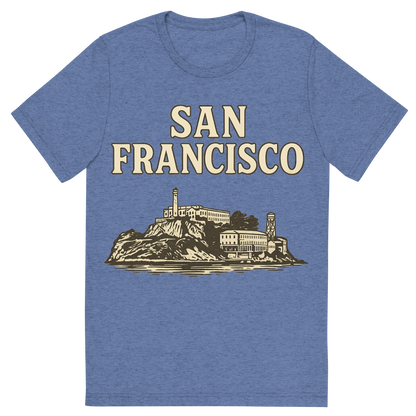 Front view of a Premium Tri-Blend Crew Neck T-Shirt in Blue showing 'A typographic, nostalgic graphic of a typographic illustration of the words 'san francisco' with a vintage line art drawing of alcatraz island'