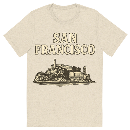 Front view of a Premium Tri-Blend Crew Neck T-Shirt in Oatmeal showing 'A typographic, nostalgic graphic of a typographic illustration of the words 'san francisco' with a vintage line art drawing of alcatraz island'