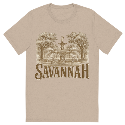 Front view of a Premium Tri-Blend Crew Neck T-Shirt in Tan showing 'A typographic, nostalgic graphic of a typographic illustration of the words 'savannah' with a vintage line art drawing of forsyth park'