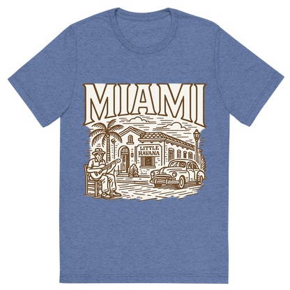 Front view of a Premium Tri-Blend Crew Neck T-Shirt in Blue showing 'A typographic, nostalgic graphic of a typographic illustration of the words 'miami' with a vintage line art drawing of little havana'