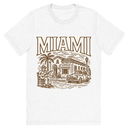Front view of a Premium Tri-Blend Crew Neck T-Shirt in Solid White showing 'A typographic, nostalgic graphic of a typographic illustration of the words 'miami' with a vintage line art drawing of little havana'