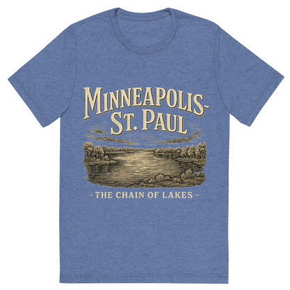 Front view of a Premium Tri-Blend Crew Neck T-Shirt in Blue showing 'A typographic, nostalgic graphic of a typographic illustration of the words 'minneapolis-st. paul' with a vintage line art drawing of the chain of lakes'