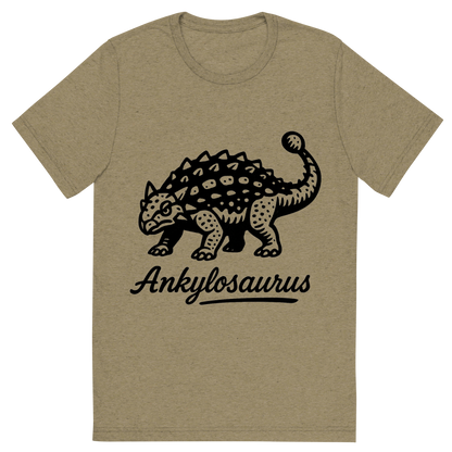 Front view of a Premium Tri-Blend Crew Neck T-Shirt in Olive showing 'A flat, neutral graphic of a bold ink drawing of an ankylosaurus with armored plates and a clubbed tail. “ankylosaurus” is inscribed below in script. ink illustration on a white background.'