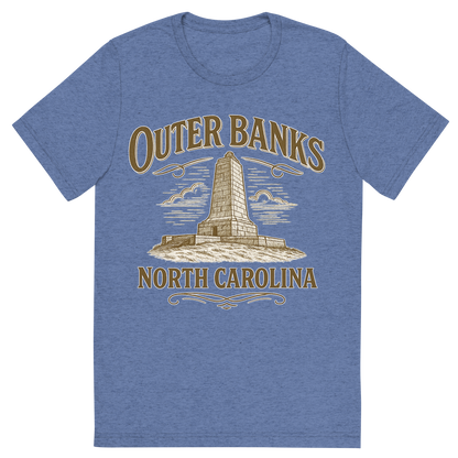 Front view of a Premium Tri-Blend Crew Neck T-Shirt in Blue showing 'A typographic, nostalgic graphic of a typographic illustration of the words 'outer banks, north carolina' with a vintage line art drawing of the wright brothers memorial'