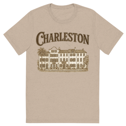 Front view of a Premium Tri-Blend Crew Neck T-Shirt in Tan showing 'A typographic, nostalgic graphic of a typographic illustration of the words 'charleston' with a vintage line art drawing of the rainbow row'
