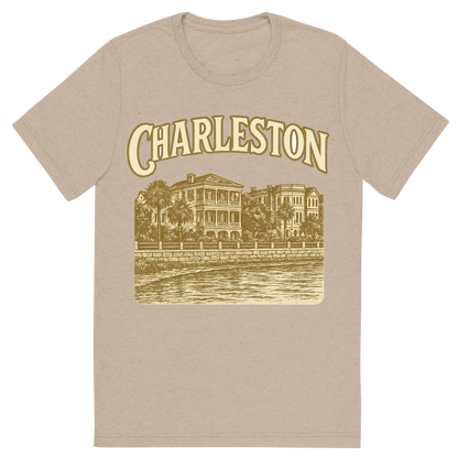 Front view of a Premium Tri-Blend Crew Neck T-Shirt in Tan showing 'A typographic, nostalgic graphic of a typographic illustration of the words 'charleston' with a vintage line art drawing of the battery'
