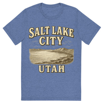 Front view of a Premium Tri-Blend Crew Neck T-Shirt in Blue showing 'A typographic, nostalgic graphic of a typographic illustration of the words 'salt lake city, utah' with a vintage line art drawing of the great salt lake'