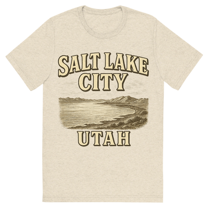 Front view of a Premium Tri-Blend Crew Neck T-Shirt in Oatmeal showing 'A typographic, nostalgic graphic of a typographic illustration of the words 'salt lake city, utah' with a vintage line art drawing of the great salt lake'