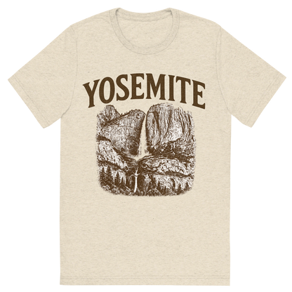 Front view of a Premium Tri-Blend Crew Neck T-Shirt in Oatmeal showing 'A typographic, nostalgic graphic of a typographic illustration of the words 'yosemite' with a vintage line art drawing of the yosemite falls'