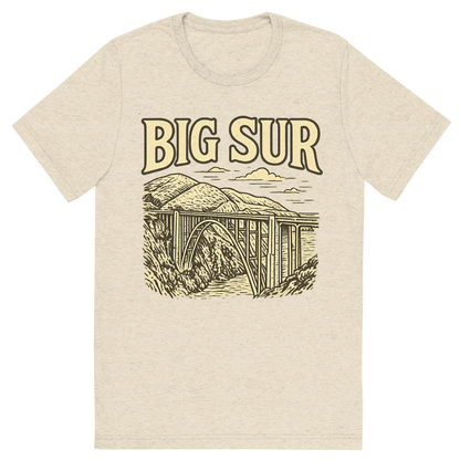Front view of a Premium Tri-Blend Crew Neck T-Shirt in Oatmeal showing 'A typographic, nostalgic graphic of a typographic illustration of the words 'big sur' with a vintage line art drawing of the bixby creek bridge'