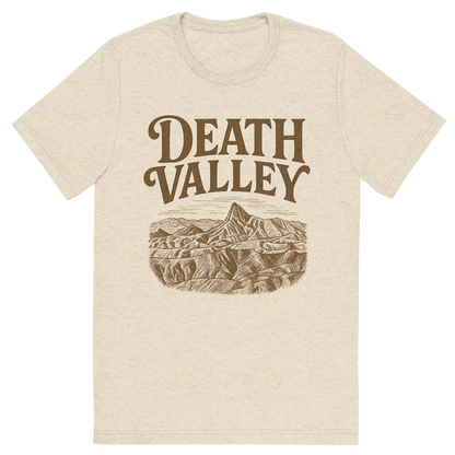 Front view of a Premium Tri-Blend Crew Neck T-Shirt in Oatmeal showing 'A typographic, nostalgic graphic of a typographic illustration of the words 'death valley' with a vintage line art drawing of zabriskie point'