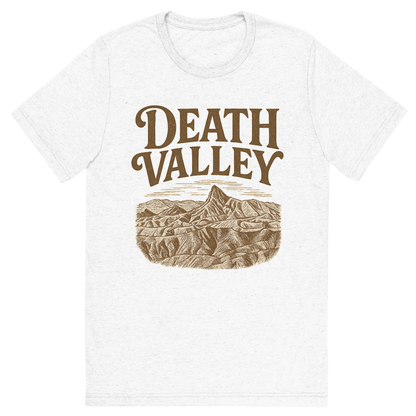 Front view of a Premium Tri-Blend Crew Neck T-Shirt in Solid White showing 'A typographic, nostalgic graphic of a typographic illustration of the words 'death valley' with a vintage line art drawing of zabriskie point'